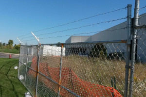 Barbed Wire on Panel Fence