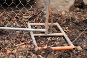 Rental panel fence base in dirt