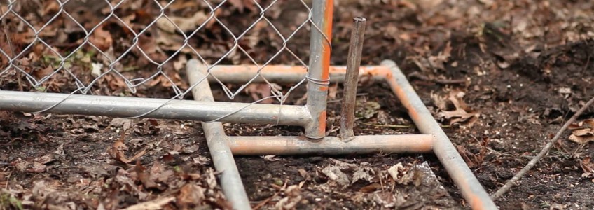 Rental panel fence base in dirt