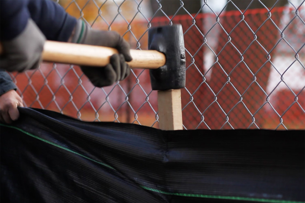 Silt fence installation with sledge hammer