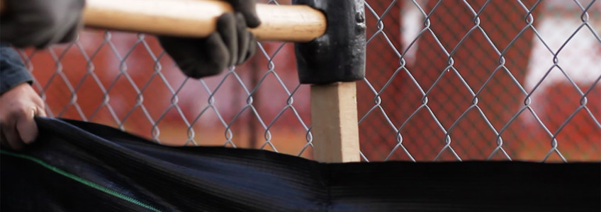 Silt fence installation with sledge hammer
